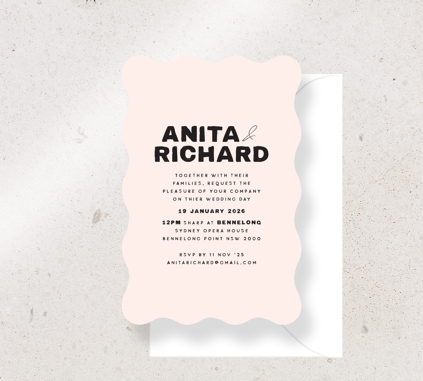 Customisable Wave invitation design from our Salut collection - Black ink on Nude card, paired here with a white envelope