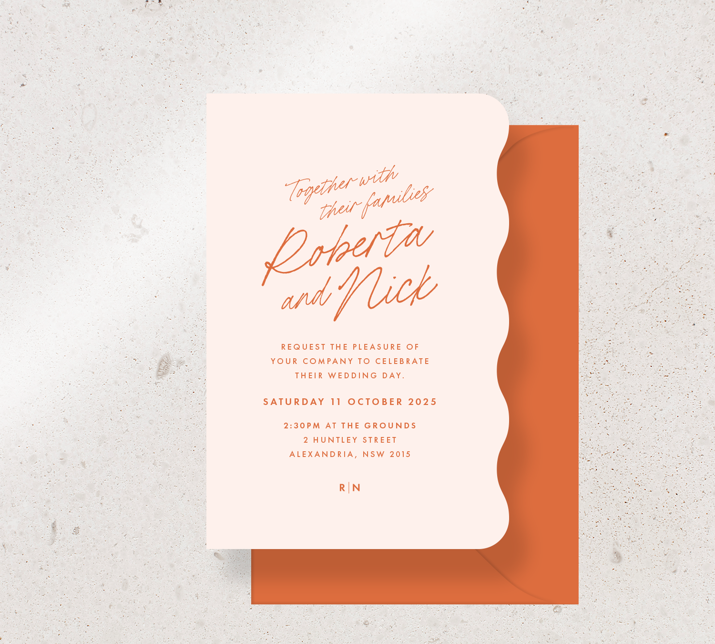 Wiggle shape invitation card from the Ardour collection - Nude stock and orange ink, paired with an orange envelope