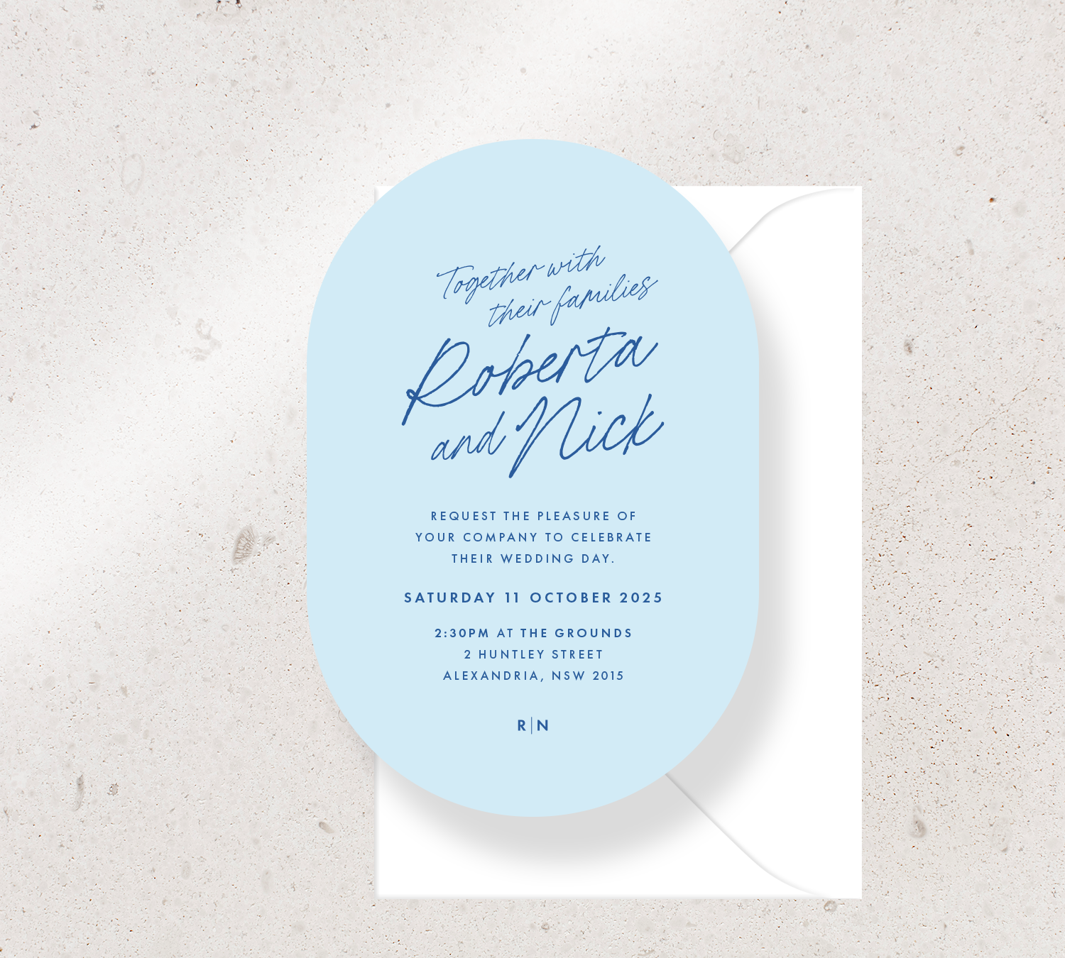 Oval shape invitation card from the Ardour collection - sky blue stock and indigo ink, paired with a white envelope